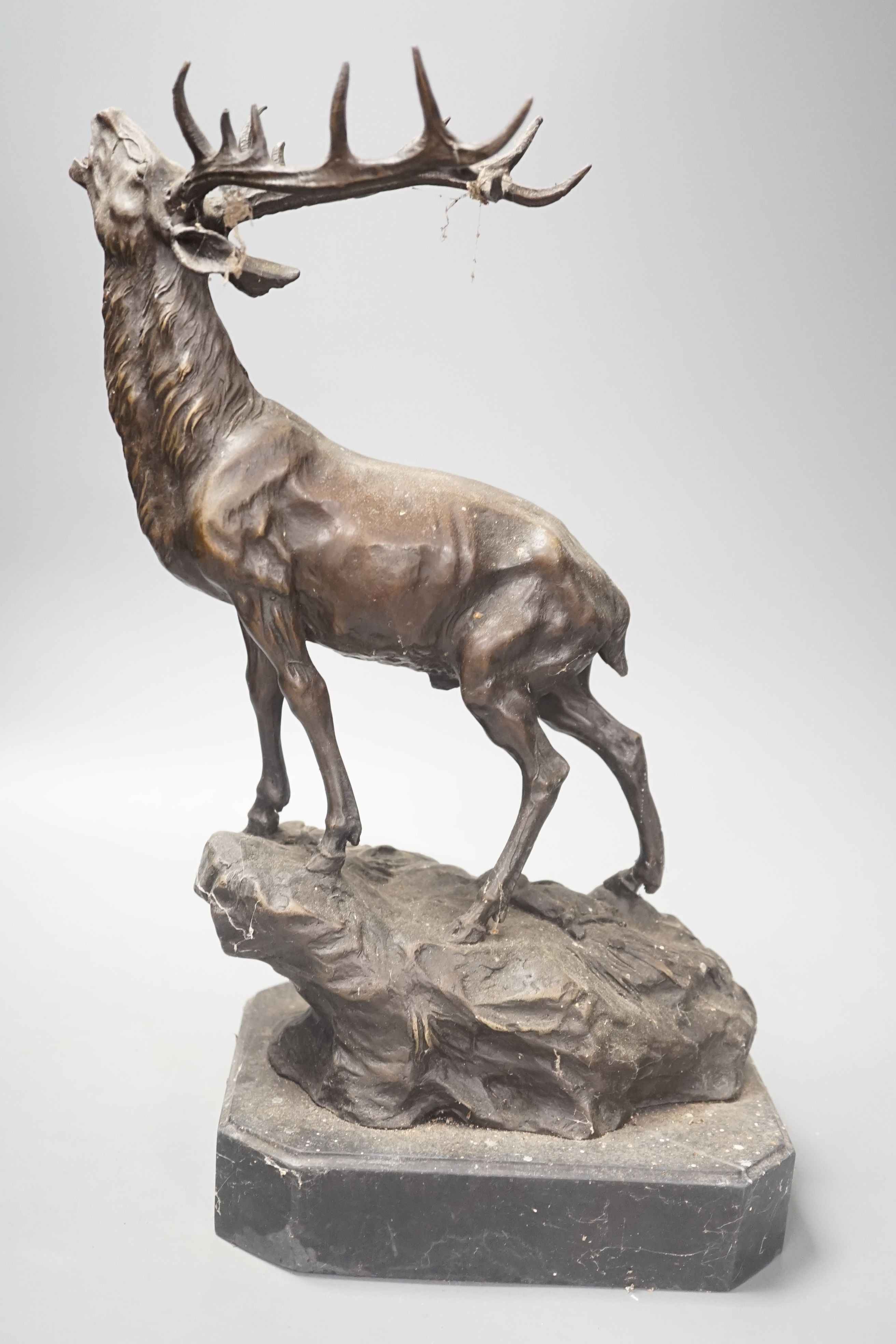 After Mene, a bronze stag on marble base, 38cm